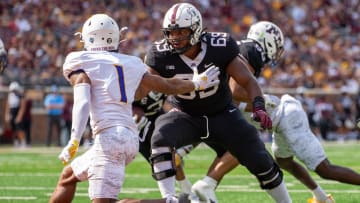 Sep 10, 2022; Minneapolis, Minnesota, USA; Minnesota Golden Gophers offensive lineman Aireontae Ersery (69) blocks Western Illinois Leathernecks defensive back JJ Ross (1) in the second quarter at Huntington Bank Stadium.