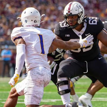 Sep 10, 2022; Minneapolis, Minnesota, USA; Minnesota Golden Gophers offensive lineman Aireontae Ersery (69) blocks Western Illinois Leathernecks defensive back JJ Ross (1) in the second quarter at Huntington Bank Stadium. Mandatory Credit: Matt Blewett-Imagn Images