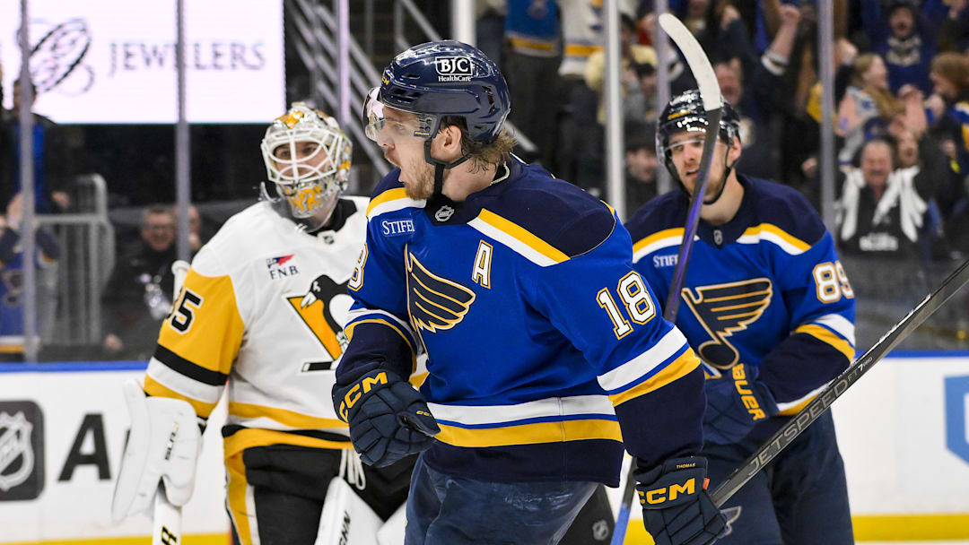 Apr 3, 2025; St. Louis, Missouri, USA;  St. Louis Blues center Robert Thomas (18) reacts after scoring the game winning goal against Pittsburgh Penguins goaltender Tristan Jarry (35) during overtime at Enterprise Center. Mandatory Credit: Jeff Curry-Imagn Images