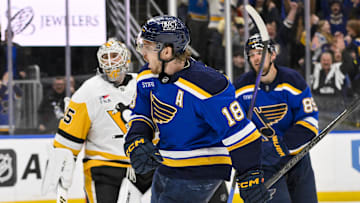 Apr 3, 2025; St. Louis, Missouri, USA;  St. Louis Blues center Robert Thomas (18) reacts after scoring the game winning goal against Pittsburgh Penguins goaltender Tristan Jarry (35) during overtime at Enterprise Center. Mandatory Credit: Jeff Curry-Imagn Images