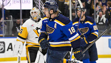 Apr 3, 2025; St. Louis, Missouri, USA;  St. Louis Blues center Robert Thomas (18) reacts after scoring the game winning goal against Pittsburgh Penguins goaltender Tristan Jarry (35) during overtime at Enterprise Center. Mandatory Credit: Jeff Curry-Imagn Images