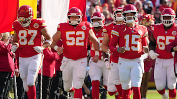 Chiefs tight end Travis Kelce (87), center Creed Humphrey (52) and guard Trey Smith (65) have helped keep the Chiefs in the playoff discussion, along with Patrick Mahomes.
