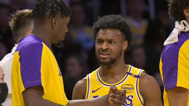 Los Angeles Lakers guard Bronny James (9) talks with forward Dorian Finney-Smith (17) during a time out in the second half ag