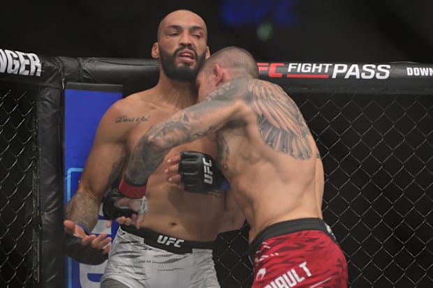Marc-Andre Barriault (red gloves) fights against Bruno Silva (blue gloves) during the UFC 315 in the Bell Center. 