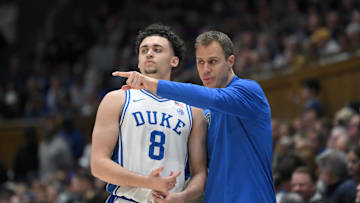 Mar 1, 2025; Durham, North Carolina, USA;  Duke Blue Devils head coach Jon Scheyer directs Duke Blue Devils guard Darren Harris (8) during the second half at Cameron Indoor Stadium. Mandatory Credit: Zachary Taft-Imagn Images