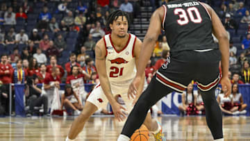 Mar 12, 2025; Nashville, TN, USA;  Arkansas Razorbacks guard D.J. Wagner (21) dribbles the ball against the South Carolina Gamecocks during the first half at Bridgestone Arena. Mandatory Credit: Steve Roberts-Imagn Images
