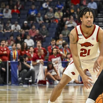 Mar 12, 2025; Nashville, TN, USA;  Arkansas Razorbacks guard D.J. Wagner (21) dribbles the ball against the South Carolina Gamecocks during the first half at Bridgestone Arena. Mandatory Credit: Steve Roberts-Imagn Images