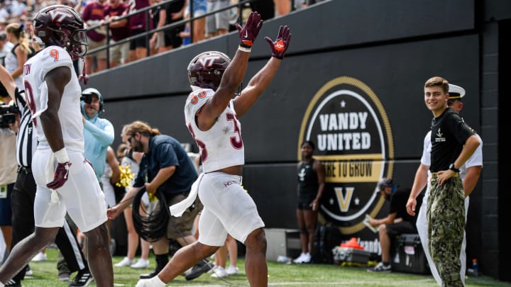 Aug 31, 2024; Nashville, Tennessee, USA;  Virginia Tech Hokies running back Bhayshul Tuten (33) celebrates his touchdown against the Vanderbilt Commodores during the second half at FirstBank Stadium. Mandatory Credit: Steve Roberts-USA TODAY Sports