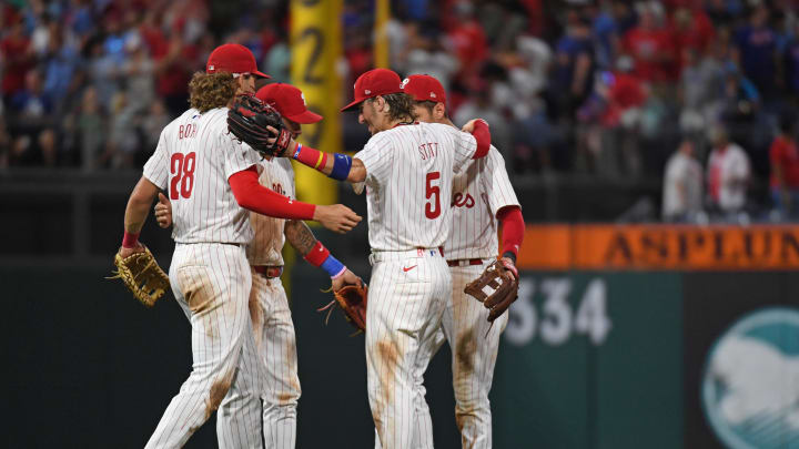 Jul 10, 2024; Philadelphia, Pennsylvania, USA; Philadelphia Phillies third base Alec Bohm (28), shortstop Edmundo Sosa (33), shortstop Trea Turner (7) and second base Bryson Stott (5) celebrate win against the Los Angeles Dodgers at Citizens Bank Park.