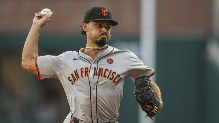 Jul 3, 2024; Cumberland, Georgia, USA; San Francisco Giants starting pitcher Jordan Hicks (12) pitches against the Atlanta Braves during the first inning at Truist Park.