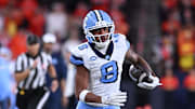 Oct 31, 2025; Syracuse, New York, USA; North Carolina Tar Heels wide receiver Kobe Paysour (8) runs after making a catch against the Syracuse Orange in the first quarter at the JMA Wireless Dome.