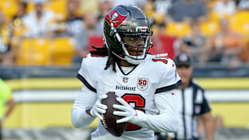 Aug 16, 2025; Pittsburgh, Pennsylvania, USA;  Tampa Bay Buccaneers quarterback Teddy Bridgewater (16) scrambles with the ball against the Pittsburgh Steelers during the first quarter at Acrisure Stadium. Mandatory Credit: Charles LeClaire-Imagn Images