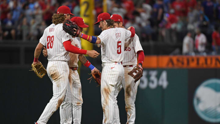 Jul 10, 2024; Philadelphia, Pennsylvania, USA; Philadelphia Phillies infielders celebrate another win.