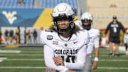 Nov 8, 2025; Morgantown, West Virginia, USA; Colorado Buffaloes quarterback Julian Lewis (10) warms up prior to their game against the West Virginia Mountaineers at Milan Puskar Stadium. Mandatory Credit: Ben Queen-Imagn Images