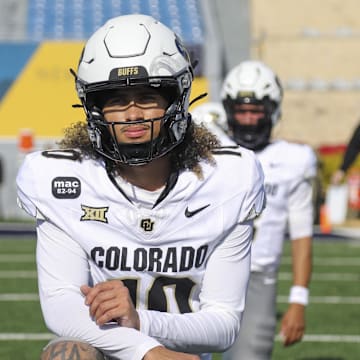 Nov 8, 2025; Morgantown, West Virginia, USA; Colorado Buffaloes quarterback Julian Lewis (10) warms up prior to their game against the West Virginia Mountaineers at Milan Puskar Stadium. Mandatory Credit: Ben Queen-Imagn Images
