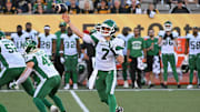 Jun 16, 2024; Hamilton, Ontario, CAN; Saskatchewan Rough Riders quarterback Trevor Harris (7) throws a pass in the first quarter against the Hamilton Tiger Cats at Tim Hortons Field. Mandatory Credit: Gerry Angus-Imagn Images