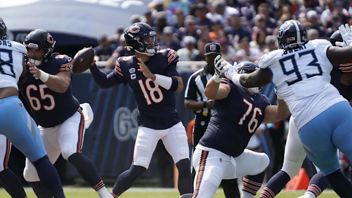 Sep 8, 2024; Chicago, Illinois, USA; Chicago Bears quarterback Caleb Williams (18) passes against the Tennessee Titans during the first half at Soldier Field. Mandatory Credit: David Banks-Imagn Images