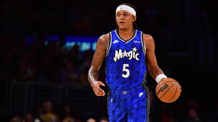 Oct 30, 2023; Los Angeles, California, USA; Orlando Magic forward Paolo Banchero (5) moves the ball up court against the Los Angeles Lakers during the first half at Crypto.com Arena. Mandatory Credit: Gary A. Vasquez-USA TODAY Sports