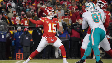 Jan 13, 2024; Kansas City, Missouri, USA; Kansas City Chiefs quarterback Patrick Mahomes (15) throws under pressure from Miami Dolphins defensive end Emmanuel Ogbah (91) during the first half of the 2024 AFC wild card game at GEHA Field at Arrowhead Stadium. Mandatory Credit: Denny Medley-USA TODAY Sports