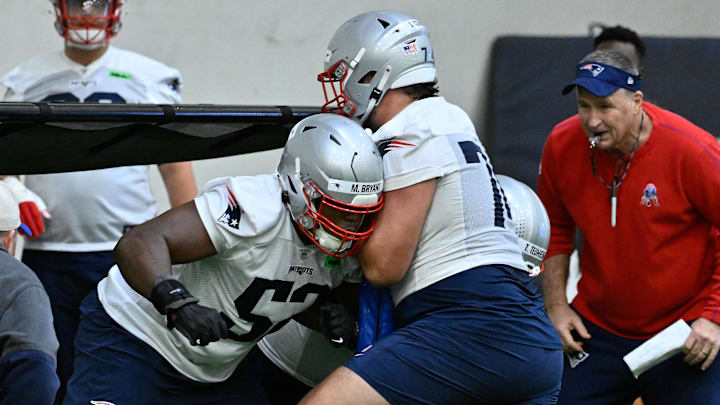 May 9, 2025; Foxborough, MA, USA; New England Patriots offensive tackle Marcus Bryant (52) works with guard Jack Conley (74) during rookie camp at Gillette Stadium. Mandatory Credit: Eric Canha-Imagn Images