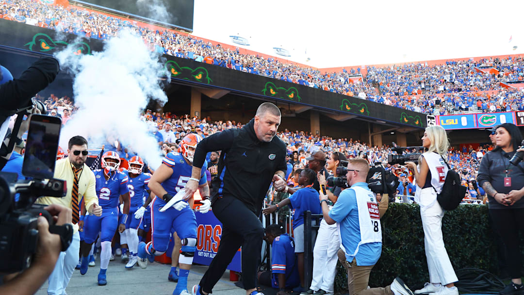Nov 16, 2024; Gainesville, Florida, USA; Florida Gators head coach Billy Napier leads the team out of the tunnel prior to the game against the LSU Tigers  at Ben Hill Griffin Stadium. Mandatory Credit: Kim Klement Neitzel-Imagn Images