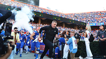 Nov 16, 2024; Gainesville, Florida, USA; Florida Gators head coach Billy Napier leads the team out of the tunnel prior to the game against the LSU Tigers  at Ben Hill Griffin Stadium. Mandatory Credit: Kim Klement Neitzel-Imagn Images