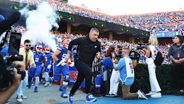 Nov 16, 2024; Gainesville, Florida, USA; Florida Gators head coach Billy Napier leads the team out of the tunnel prior to the game against the LSU Tigers  at Ben Hill Griffin Stadium. Mandatory Credit: Kim Klement Neitzel-Imagn Images