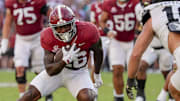 Oct 4, 2025; Tuscaloosa, Alabama, USA;  Alabama running back Jam Miller (26) runs the ball as Vanderbilt linebacker Langston Patterson (10) closes at Saban Field at Bryant-Denny Stadium. Alabama downed Vanderbilt 30-14. Mandatory Credit: Gary Cosby Jr.-Imagn Images