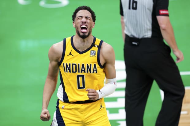 Indiana Pacers guard Tyrese Haliburton (0) reacts after his three-point basket.