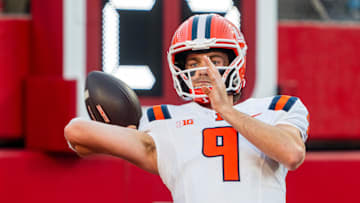 Sep 20, 2024; Lincoln, Nebraska, USA; Illinois Fighting Illini quarterback Luke Altmyer (9) warms up before a game against the Nebraska Cornhuskers at Memorial Stadium. Mandatory Credit: Dylan Widger-Imagn Images