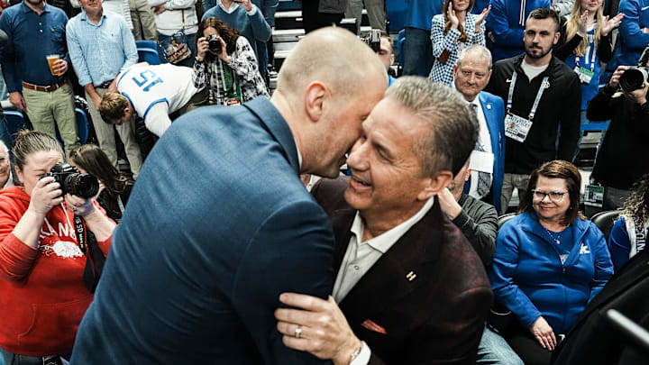 Former UK coach and current Arkansas coach John Calipari hugs Kentucky coach Mark Pope before the game Saturday Feb. 1, 2025 at Rupp Arena in Lexington, Kentucky.