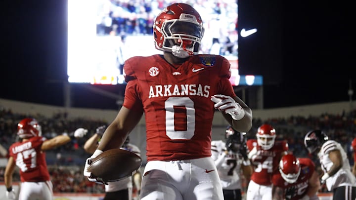 Dec 27, 2024; Memphis, TN, USA; Arkansas Razorbacks running back Braylen Russell (0) reacts after a touchdown during the first quarter against the Texas Tech Red Raiders at Simmons Bank Liberty Stadium. Mandatory Credit: Petre Thomas-Imagn Images