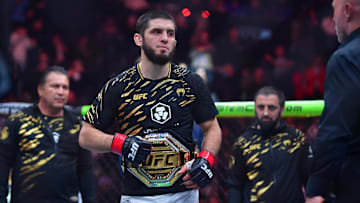 Jan 18, 2025; Inglewood, California, USA; Islam Makhachev (red gloves) reacts after defeating Renato Moicano (not pictured) in a lightweight title fight during UFC 311 at Intuit Dome. Mandatory Credit: Gary A. Vasquez-Imagn Images