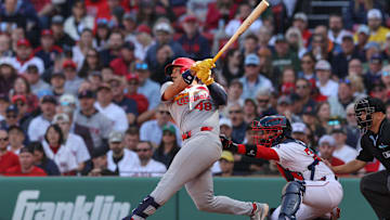 Apr 4, 2025; Boston, Massachusetts, USA; St. Louis Cardinals catcher Ivan Herrera (48) hits a three run home run during the fourth inning against the Boston Red Sox at Fenway Park. Mandatory Credit: Paul Rutherford-Imagn Images