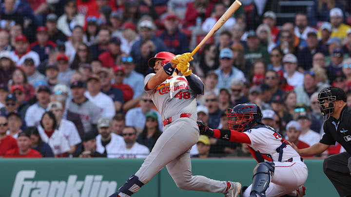 Apr 4, 2025; Boston, Massachusetts, USA; St. Louis Cardinals catcher Ivan Herrera (48) hits a three run home run during the fourth inning against the Boston Red Sox at Fenway Park. Mandatory Credit: Paul Rutherford-Imagn Images
