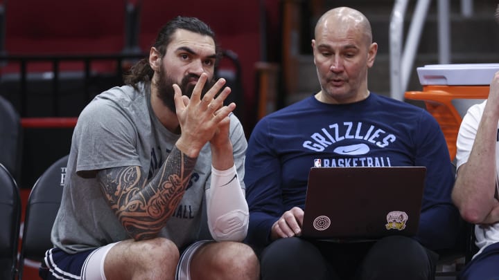 Mar 6, 2022; Houston, Texas, USA; Memphis Grizzlies center Steven Adams (4) talks with assistant coach Vitaly Potapenko before the game against the Houston Rockets at Toyota Center. Mandatory Credit: Troy Taormina-USA TODAY Sports