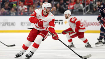 Detroit Red Wings' forward Andrew Copp (18) skates with the puck.