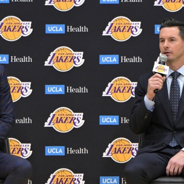 Jun 24, 2024; El Segundo, CA, USA; Los Angeles Lakers general manager Rob Pelinka loosk on as head coach JJ Redick speaks to the media during an introductory news conference at the UCLA Health Training Center. Mandatory Credit: Jayne Kamin-Oncea-USA TODAY Sports