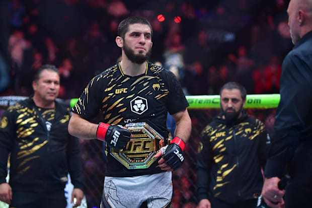 Islam Makhachev (red gloves) reacts after defeating Renato Moicano (not pictured) in a lightweight title fight during UFC 311