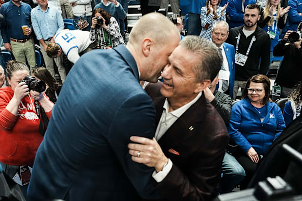 Pope and Calipari greet each other before the game.