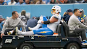 Nov 2, 2025; Nashville, Tennessee, USA;  Los Angeles Chargers offensive tackle Joe Alt (76) gets carted off against the Tennessee Titans during the first half at Nissan Stadium. Mandatory Credit: Steve Roberts-Imagn Images