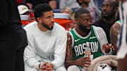 Oct 8, 2025; Memphis, Tennessee, USA; Boston Celtics forward Jayson Tatum (0) and guard Jaylen Brown (7) look on from the bench during the second quarter against the Memphis Grizzlies at FedExForum. Mandatory Credit: Petre Thomas-Imagn Images