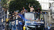 Nov 3, 2025; Los Angeles, CA, USA;  Los Angeles Dodgers first baseman Enrique Hernandez (middle) and second baseman Miguel Rojas (right) acknowledges the crowd during the World Series championship parade at downtown Los Angeles. Mandatory Credit: Kiyoshi Mio-Imagn Images