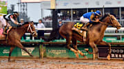 Sovereignty, with jockey Junior Alvarado up, leads Journalism, with jockey Umberto Rispoli up, to the finish line to win the 151st running of The Kentucky Derby.
