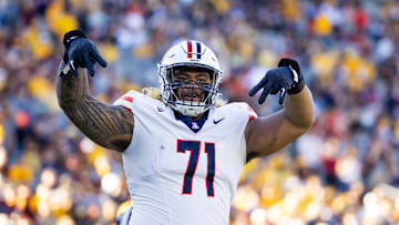 Nov 25, 2023; Tempe, Arizona, USA; Arizona Wildcats offensive lineman Jonah Savaiinaea (71) celebrates a touchdown against the Arizona State Sun Devils in the second half of the Territorial Cup at Mountain America Stadium. Mandatory Credit: Mark J. Rebilas-Imagn Images