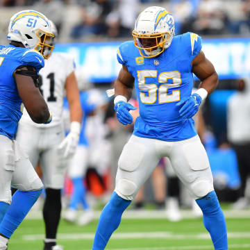 Oct 1, 2023; Inglewood, California, USA; Los Angeles Chargers linebacker Khalil Mack (52) reacts after sacking Las Vegas Raiders quarterback Aidan O'Connell (4) with defensive tackle Sebastian Joseph-Day (51) during the second half at SoFi Stadium. Mandatory Credit: Gary A. Vasquez-USA TODAY Sports