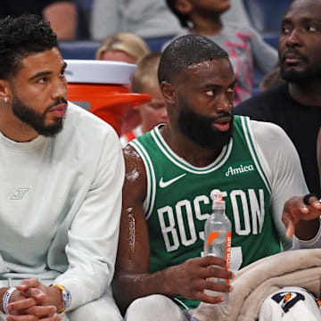 Oct 8, 2025; Memphis, Tennessee, USA; Boston Celtics forward Jayson Tatum (0) and guard Jaylen Brown (7) look on from the bench during the second quarter against the Memphis Grizzlies at FedExForum. Mandatory Credit: Petre Thomas-Imagn Images