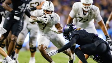 Sep 14, 2024; Fort Worth, Texas, USA; UCF Knights running back RJ Harvey (7) breaks through the line of scrimmage during the fourth quarter against the TCU Horned Frogs at Amon G. Carter Stadium. Mandatory Credit: Andrew Dieb-Imagn Images