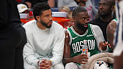 Oct 8, 2025; Memphis, Tennessee, USA: Boston Celtics forward Jayson Tatum (0) and guard Jaylen Brown (7) look on from the bench during the second quarter against the Memphis Grizzlies at FedExForum. Mandatory Credit: Petre Thomas-Imagn Images