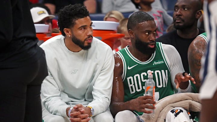 Oct 8, 2025; Memphis, Tennessee, USA: Boston Celtics forward Jayson Tatum (0) and guard Jaylen Brown (7) look on from the bench during the second quarter against the Memphis Grizzlies at FedExForum. Mandatory Credit: Petre Thomas-Imagn Images